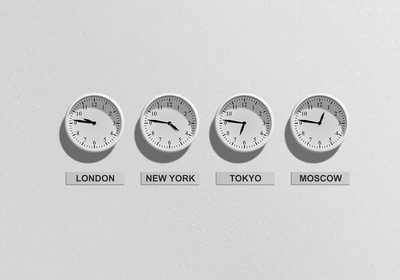 Four clocks with different times on each of them.